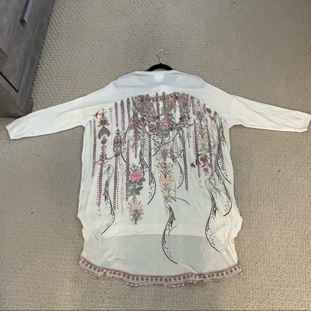 Beautiful long sleeve sweater with print on back. Very soft. Brand new w/ tags